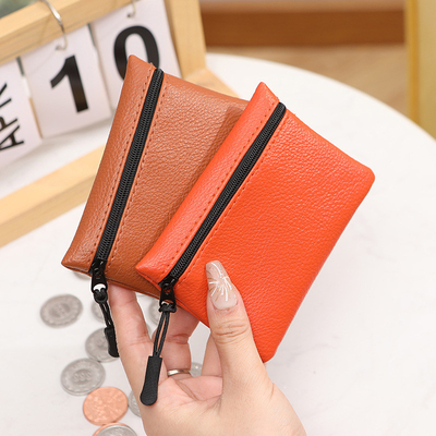 2024 Nuevo patrón de lichi cerradura bolso de monedas de color sólido PU bolsa de cartón de monedas de piel suave mujer