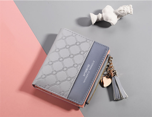 La versión coreana de la nueva cartera corta de mujeres cartera corta de color de flexión cartera corta de franjas de cremallera de monedas de múltiples tarjetas cartera en stock