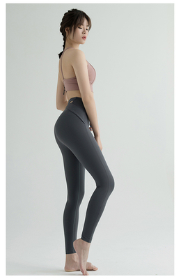 Nuevos pantalones de yoga de cintura alta mujeres Europa y los EE.UU. ejercicios de cadera de melocotón velocidad de carrera apretada ropa de yoga seca cuello