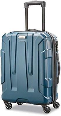 El equipaje expandible de lado duro con ruedas giratorias, de color azul, de mediano y de 24 pulgadas.